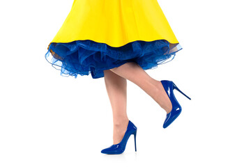 Bright yellow dress and stylish blue heels create a vibrant fashion statement