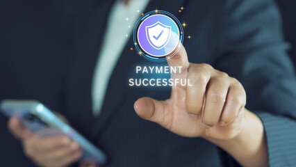 Secure payment success represented by glowing shield with check mark with businessman hand tapping on dark background. Digital transaction security concept.