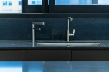faucets at the sink in the kitchen