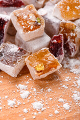 Sweet food Turkish delight, assorted rahat locum in form of cubes with nuts and powdered sugar, traditional food