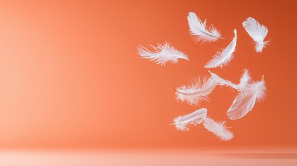 Obraz premium Group of white feathers floating gracefully in the air against a clear blue sky