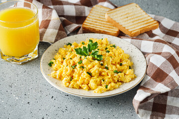 Scrambled Eggs and Juice Delicious Breakfast Meal with Toast and Fresh Ingredients