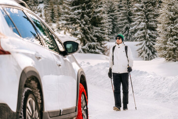 Man Traveler Walking to Car in Winter Forest