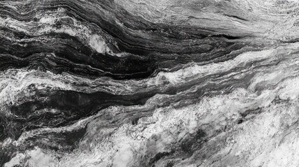 Naklejka premium Monochrome black and white abstract texture, with smooth, flowing patterns and contrasting dark and light sections.