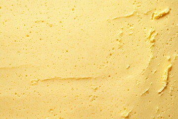 Close-up texture of pale yellow creamy substance