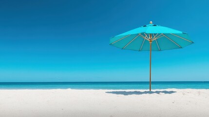 A serene and inviting beach scene with a single turquoise umbrella standing tall on pristine white sand under a bright blue sky, symbolizing relaxation and leisure.