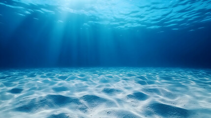 Underwater ocean scene, sun rays illuminating sandy seabed, tranquil background, ideal for travel or nature documentaries