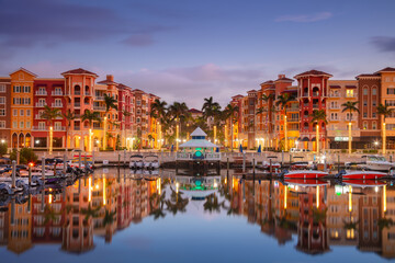 Naples, Florida, USA. Cityscape image of Naples, Florida with reflection of the city skyline in the...