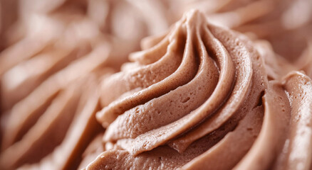Rich chocolate frosting swirls create a tempting display of creamy texture and indulgent sweetness, perfect for decorating cakes or enjoying on its own at dessert events
