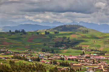 Fototapeta premium Endless beauty in the farmlands near Moray and Maras, where ancient techniques meet breathtaking landscapes. The heart of Peru’s agricultural history still thrives here.