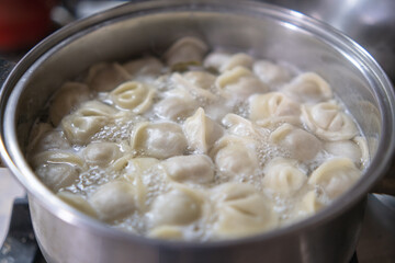 Process of cooking homemade dumplings.