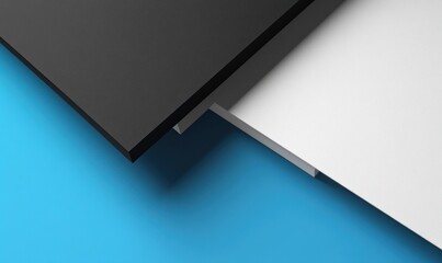 Abstract geometric shapes, black, white, and blue background.