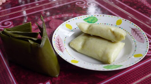 South Kalimantan's special food called lepat or buras is served on a plate.