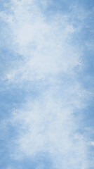 Soft pastel blue sky background with clouds