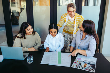 College students engage in a learning session with professor in a classroom setting