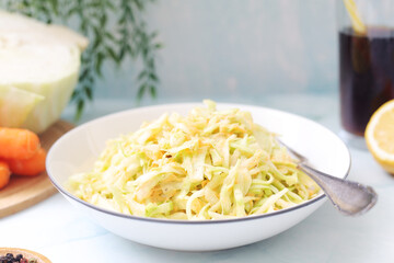 A bowl with coleslow salad	