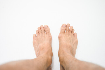 Obraz premium Bare feet person on white background
