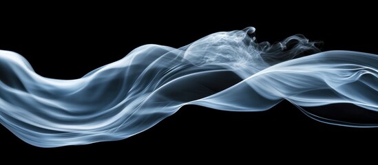 Fototapeta premium Blue smoke wave flowing on black background, design element