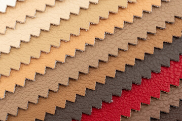 Palette of multi-colored pieces of genuine leather. Accessories for sewing. Leather material