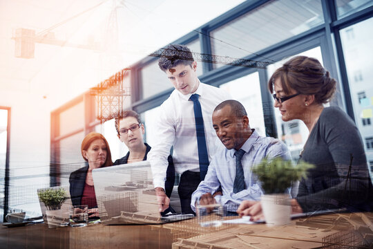 Team, engineer and business people with laptop for double exposure or construction in office. Group, discussion and architect in meeting for city project plan, building development or crane overlay - Powered by Adobe