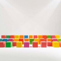 Volumetric lighting illuminates a grid of brightly colored foam children's blocks viewed from directly above.  The white background is clean.
