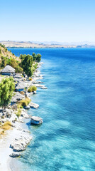 Lakeside huts, tranquil lake, scenic landscape, summer vacation getaway