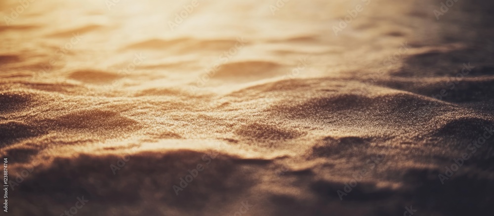 Poster close-up of sandy texture under warm light with soft ripples and patterns suitable for background or