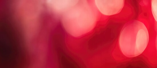 Abstract blurred red background with soft bokeh lights and warm tones ideal for overlays and copy space