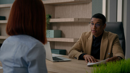 Business consultation in office African American man businessman salesman recruiter consulting...