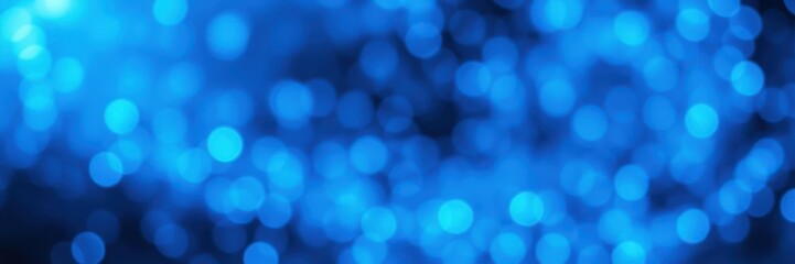 Beautiful blue bokeh lights creating a captivating abstract background during nighttime celebrations