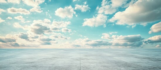 Empty concrete floor with vast cloudy sky background and copy space