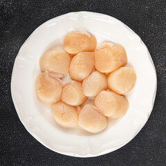 Sea scallop raw seafood fresh tasty food dish gourmet food background on the table rustic food top view copy space food pescetarian diet