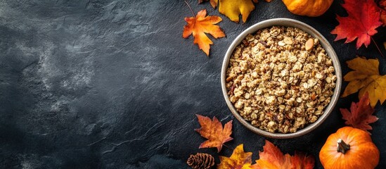 Bowl of Granola with Autumn Leaves and Pumpkins on Dark Background with Copy Space