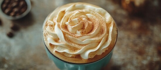 Creamy Cappuccino with Whipped Cream and Coffee Beans in Background on Rustic Table
