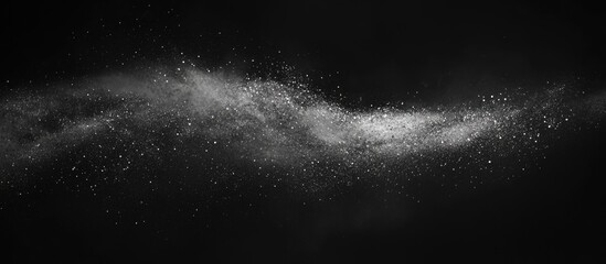 Abstract Black and White Powder Explosion against Dark Background with Copy Space