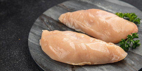 Chicken breast raw meat of the bird fresh tasty food dish gourmet food background on the table rustic food top view copy space keto and paleo diet