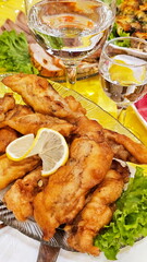 Fish fillet in batter on the festive table