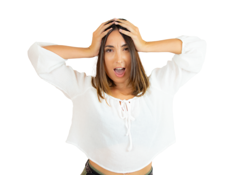 Frustrated young brunette woman with hands on head isolated over transparent background. PNG transparent.