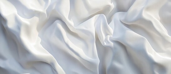 Obraz premium White satin fabric with smooth folds and creases suitable for background or textile design. Copy Space available.