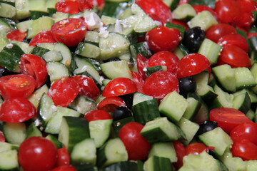 A Freshly Made Finely Cut Tomato and Cucumber Salad.