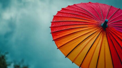 Red Orange Umbrella in Rain and Stormy Sky