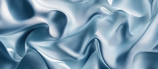 Obraz premium Smooth blue satin fabric texture with intricate folds and ripples, ideal for backgrounds or textile designs. Copy Space