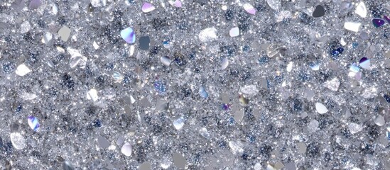Silver glitter texture background with varying shapes sparkling under light, ideal for creative projects, Copy Space.