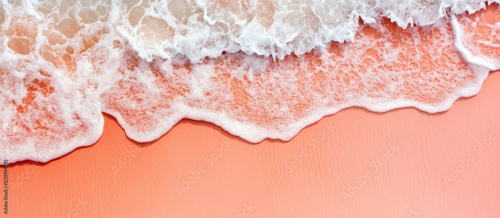 Poster aerial view of coral colored beach with foamy waves and smooth sand texture, providing ample copy sp