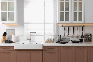 Stylish kitchen interior with mocha mousse shade. Trendy color of 2025 year