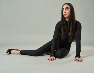 Elegant woman posing on the floor