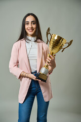 Happy woman holding a trophy