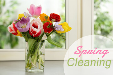 Spring cleaning. Beautiful tulips in glass vase on windowsill