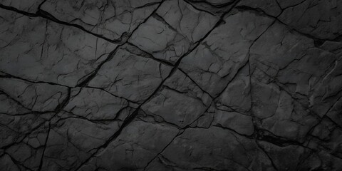 Volumetric rock texture with cracks. Black stone background with copy space for design. Wide banner.