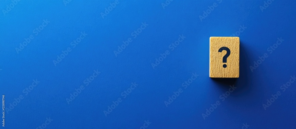 Fototapete wooden block with question mark symbol on blue background with copy space for text.
